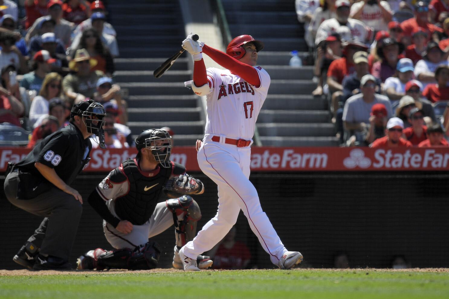 Garcia goes deep again as Rangers roll past Rockies 7-2