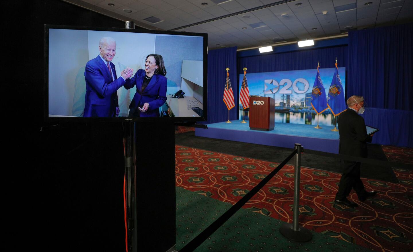 Joe Biden and Kamala Harris appear on a video feed at the start of the second day of the Democratic National Convention.