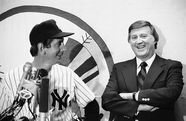 New York Yankees owner George Steinbrenner laughing as Billy Martin answers reporters' questions at a news conference in 1978 at Yankee Stadium. Steinbrenner hired and fired Martin as manager five times.