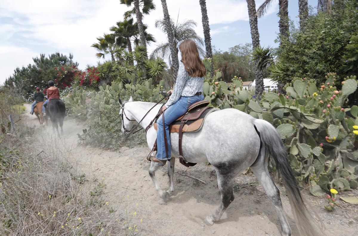 Riders take to the trail near the Ortega Equestrian Center in San Juan Capistrano on Wednesday, May 5, 2020.
