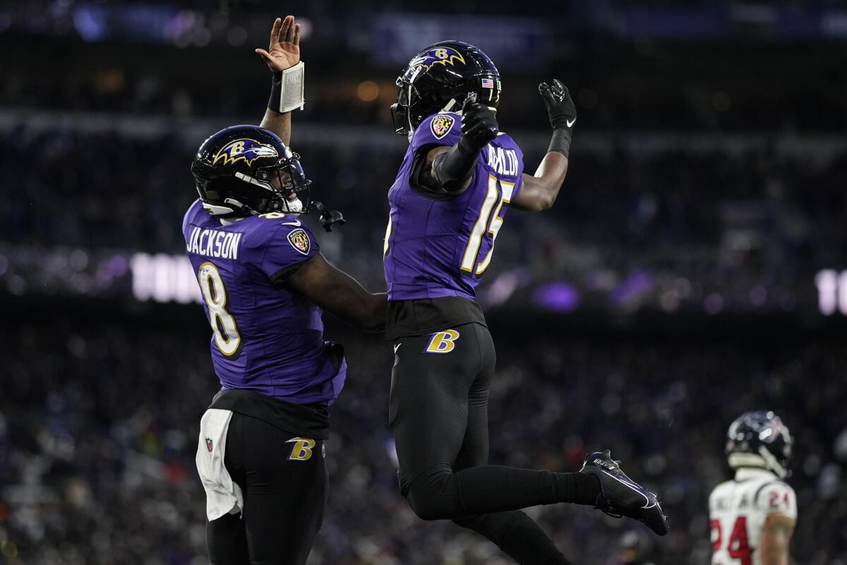 Baltimore Ravens wide receiver Nelson Agholor, right, celebrates his touchdown catch with quarterback Lamar Jackson.