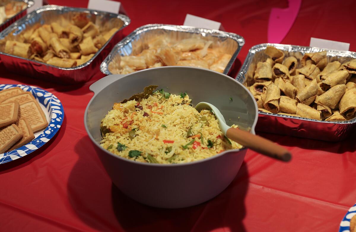 An Indian pulao rice bowl with other international foods on display.