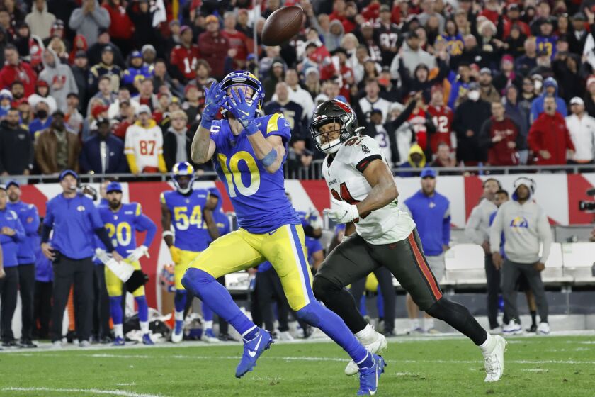 Rams wide receiver Cooper Kupp hauls in a catch against Buccaneers safety Antoine Winfield Jr.