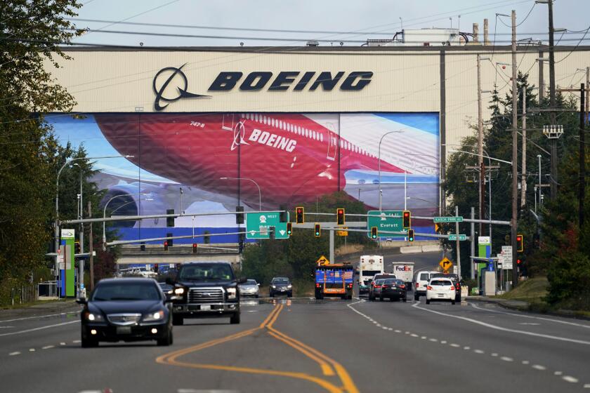FILE - In this Oct. 1, 2020 file photo, traffic passes the Boeing airplane production plant, in Everett, Wash. The European Union pressed ahead Monday Nov. 9, 2020, with plans to impose tariffs and other penalties on up to $4 billion worth of U.S. goods and services over illegal American support for plane maker Boeing, but expressed hope that trade ties would improve once President Donald Trump leaves office. (AP Photo/Elaine Thompson, file)
