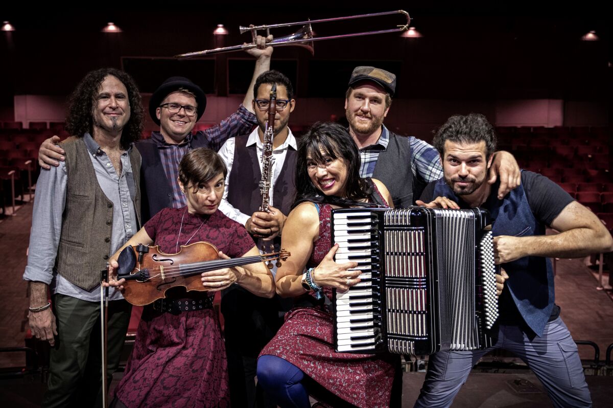 A photo of L.A.-based band Mostly Kosher with instruments.
