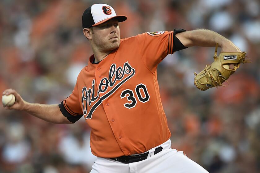 Baltimore Orioles pitcher Chris Tillman delivers against the Houston Astros in the first inning on Aug. 20.