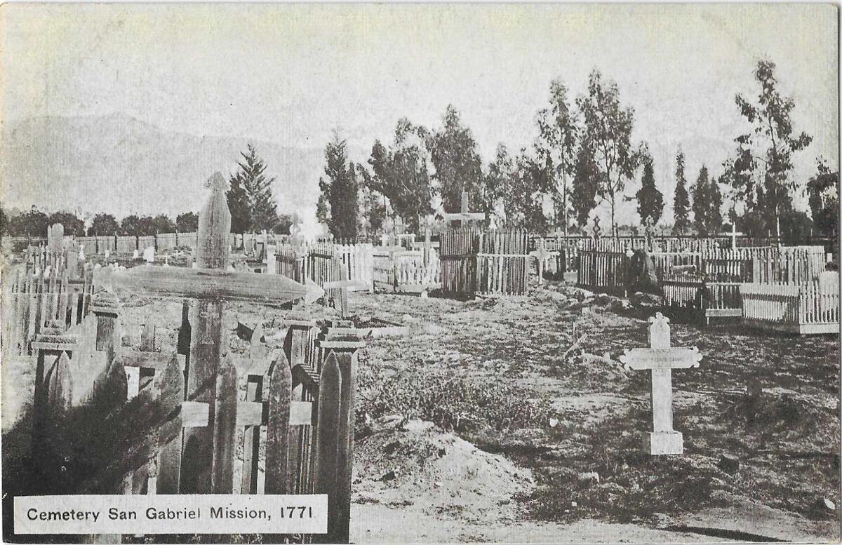 Black and white image shows crosses in a graveyard