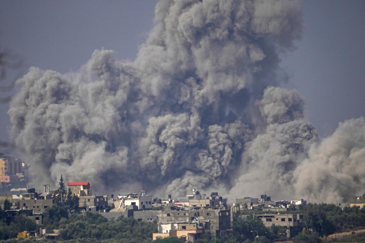 Smoke rises following an Israeli airstrike in the Gaza Strip, as seen from southern Israel on Oct. 23.