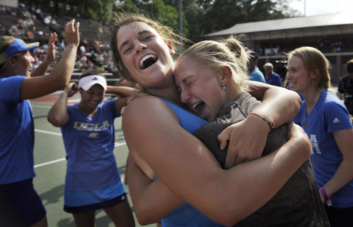 Jennifer Brady, center, celebrates with teammates after UCLA won the 2014 national championship. 