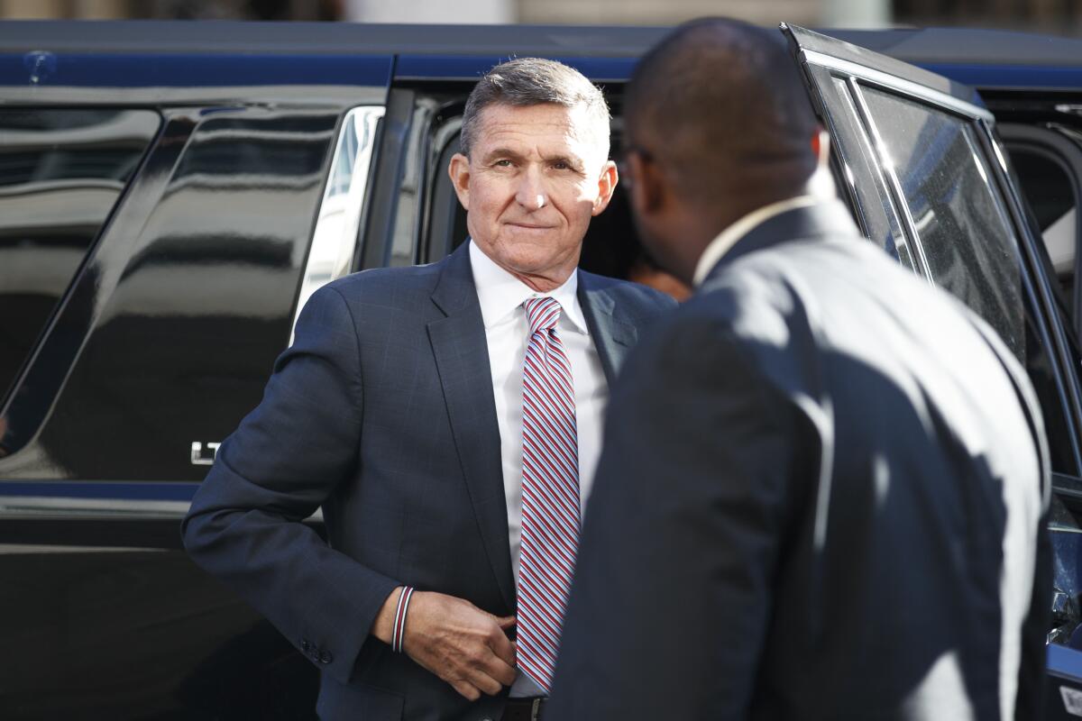 President Trump's former national security advisor Michael Flynn steps from an automobile outside court 