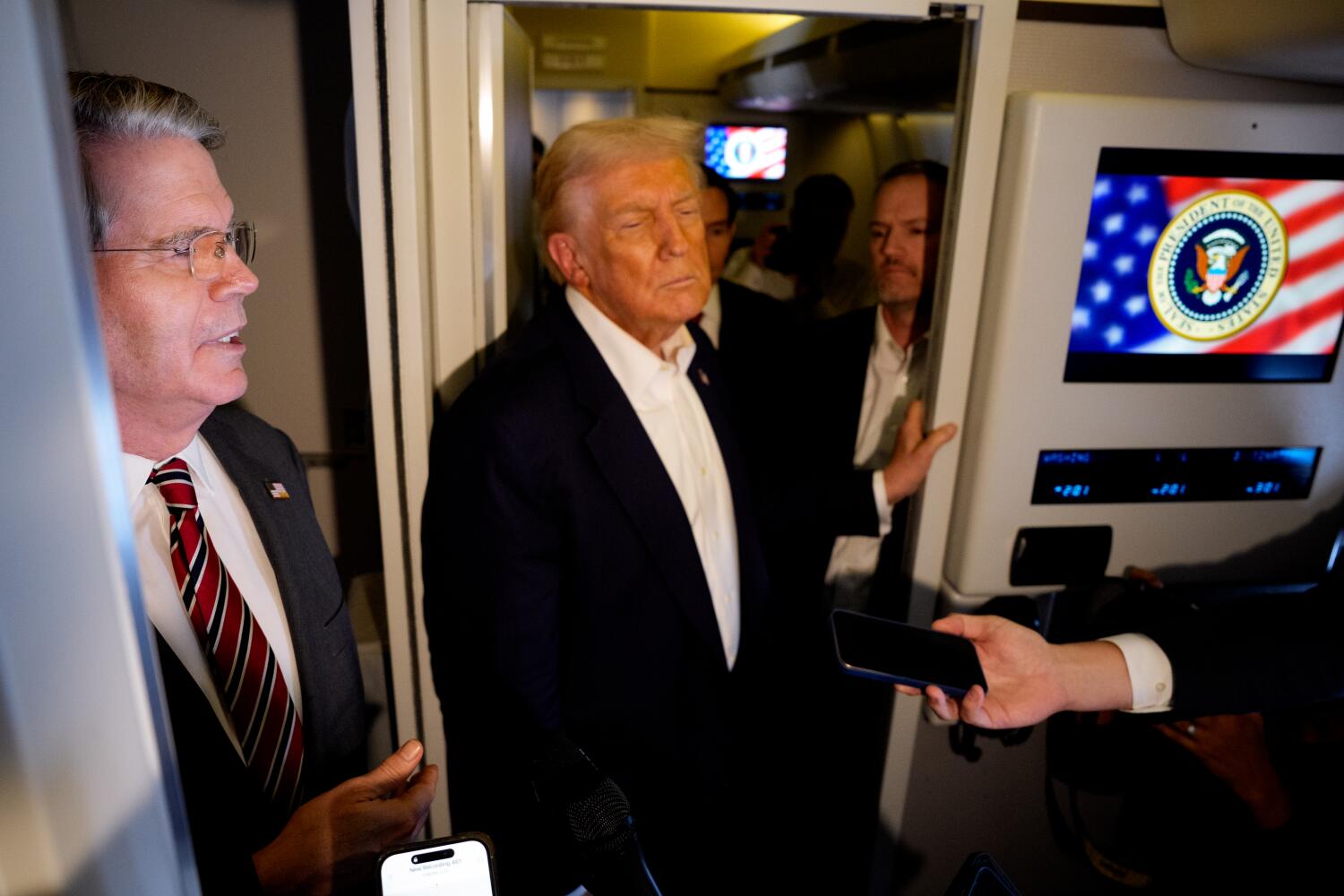 IN FLIGHT - OCTOBER 27: U.S. Treasury Secretary Scott Bessent (L), accompanied by U.S. President Donald Trump and U.S. Trade Representative Jamieson Greer (R), speaks to members of the media aboard Air Force One on October 27, 2025, in flight. Trump is in route to Japan after attending the Association of Southeast Asian Nations (ASEAN) summit in Malaysia, and will travel on to South Korea for the Asia-Pacific Economic Cooperation (APEC) forum. (Photo by Andrew Harnik/Getty Images)