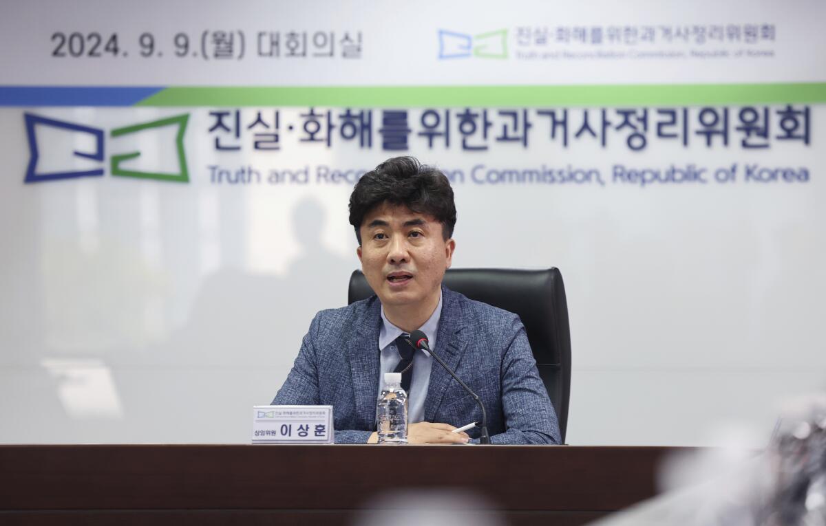 Lee Sang Hoon, a Truth and Reconciliation Commission member, speaks to the media in Seoul.