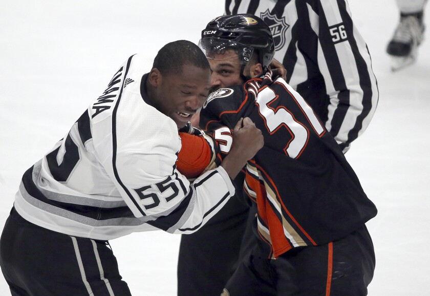 Kings forward Boko Imama, left, and fights Ducks left winger Mike Liambas fight during a preseason game in September 2017.