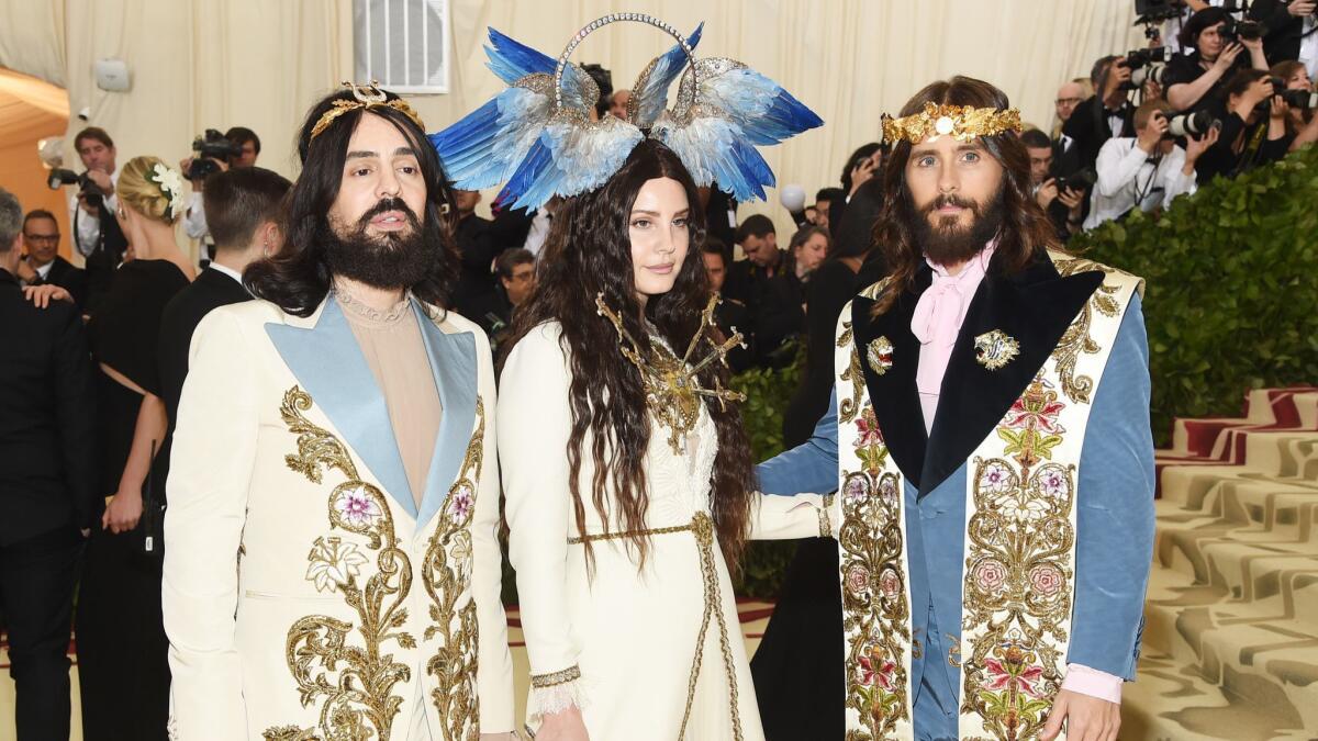 Gucci creative director Alessandro Michele, from left, Lana Del Rey and Jared Leto (all in Gucci) mined religious motifs for the 2018 Met Gala.