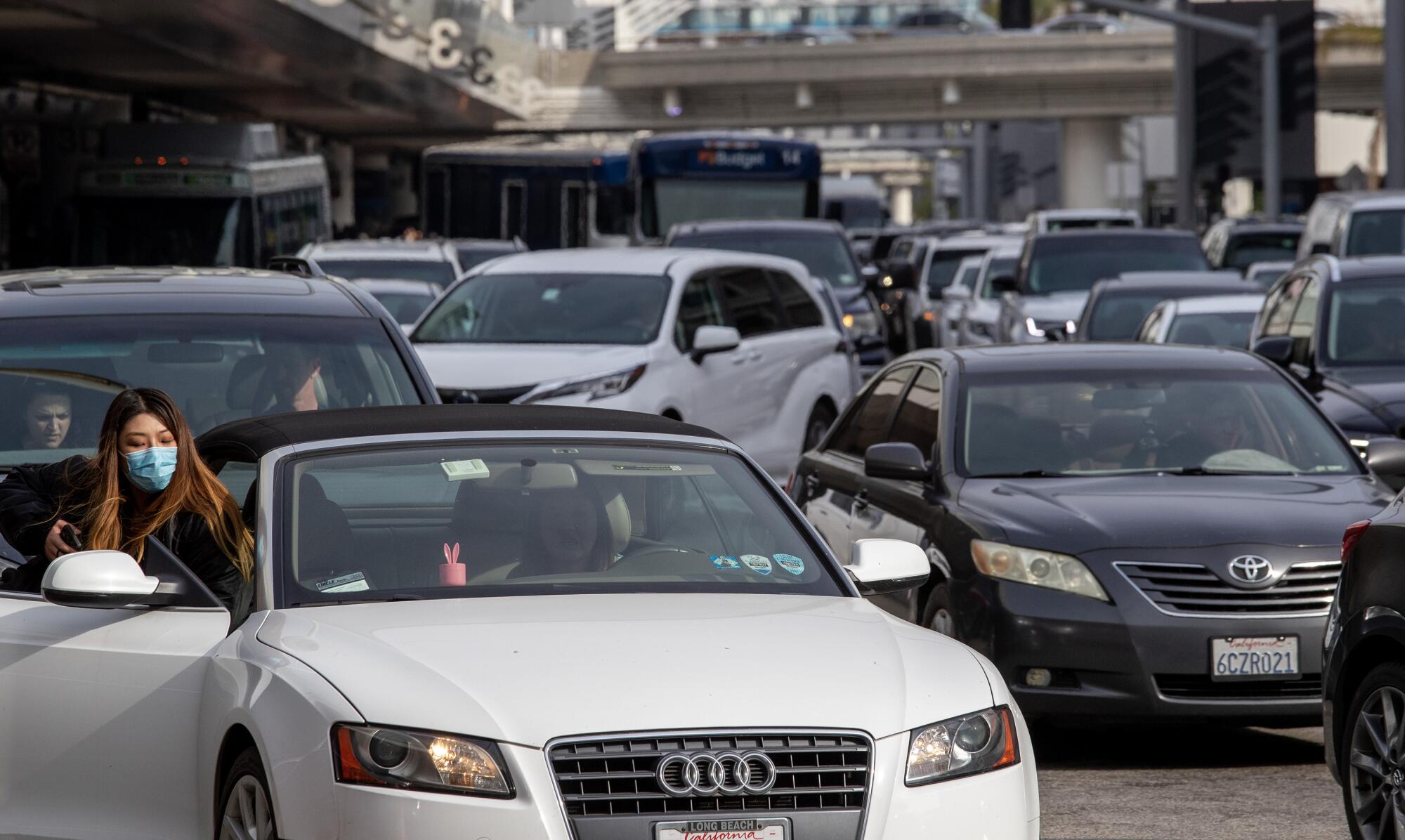 Many vehicles fill the road around Los Angeles International Airport.