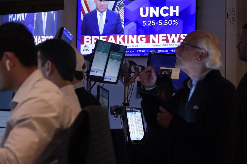 A television screen on the floor of the New York Stock Exchange, shows the Federal Reserve rate decision, Wednesday, July 31, 2024.(AP Photo/Richard Drew)