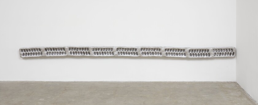 “OV One” by Nancy Lupo, 2015-17, is made with materials including ice trays and fibered aluminum roof coating.