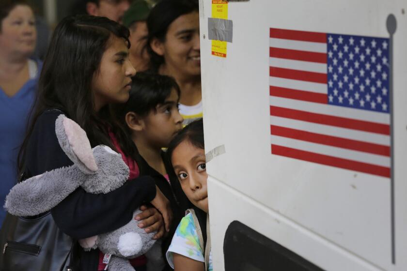 Immigrants from El Salvador and Guatemala who entered the country illegally board a bus after being released from a family detention center in San Antonio, Texas on July 7.