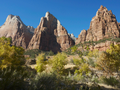 The Navajo sandstone cliffs of Zion's Three Patriarchs -- Abraham, Isaac and Jacob -- as seen from the Sand Bench Trail.