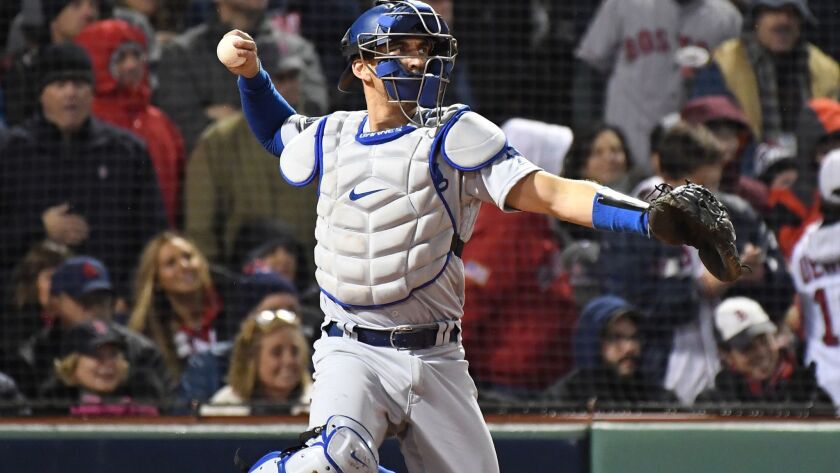 Dodgers catcher Austin Barnes throws in the sixth inning of Game 1 of the World Series at Fenway Park in Boston on Tuesday.