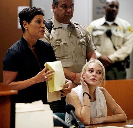 Lindsay Lohan listens as her attorney, Shawn Chapman Holley, makes her case to the judge.