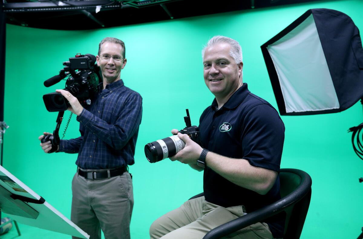 City of Glendale broadcast coordinators Brian Halloran, left, and Robert Townsend in the GTV6 studio, which runs two government-access channels and is undergoing an overhaul staff say is necessary to keep the operations functional.