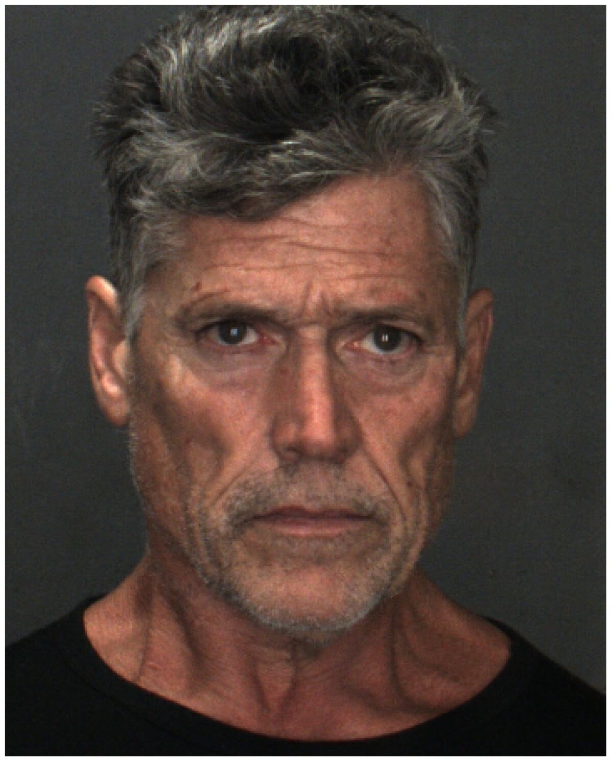 A man in a booking photo