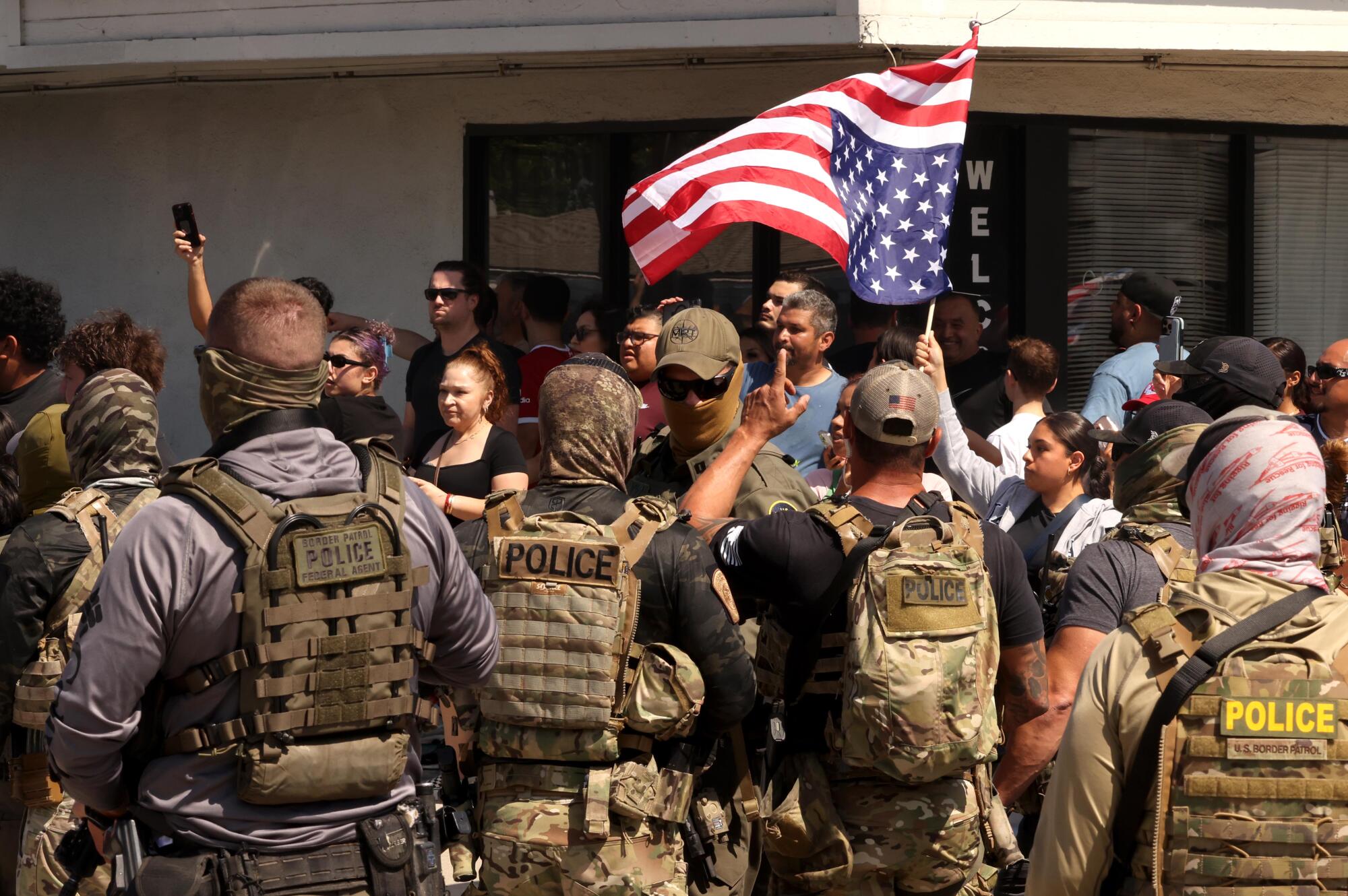 Residents confront ICE agents and Border Patrol agents as residents scream over their presence in their neighborhood