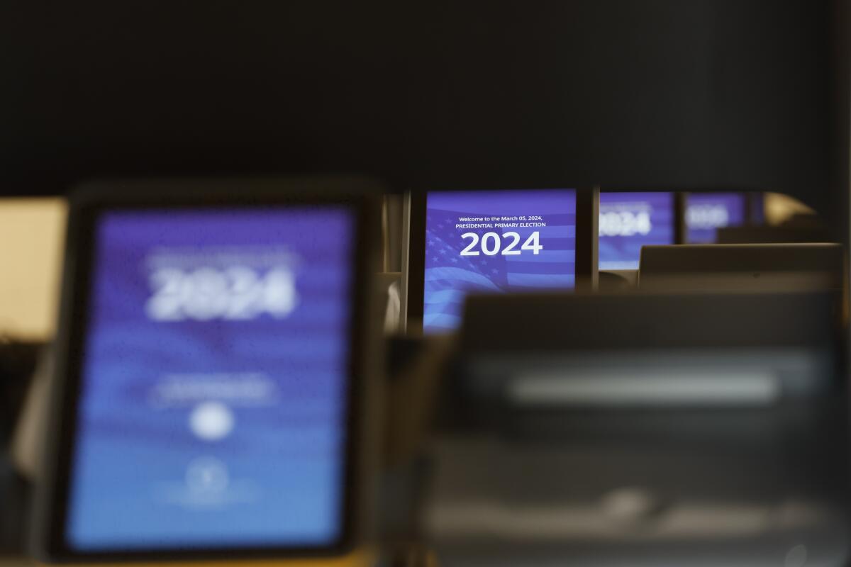 A view of voting machines as voters cast their ballots during Super Tuesday primary election