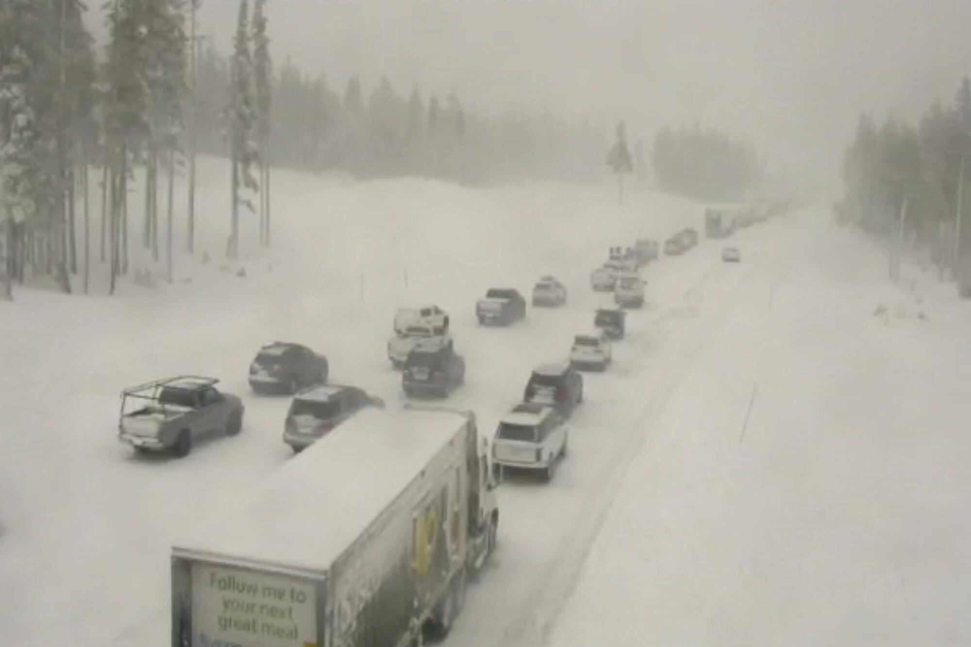 Traffic stopped on a snow-covered highway