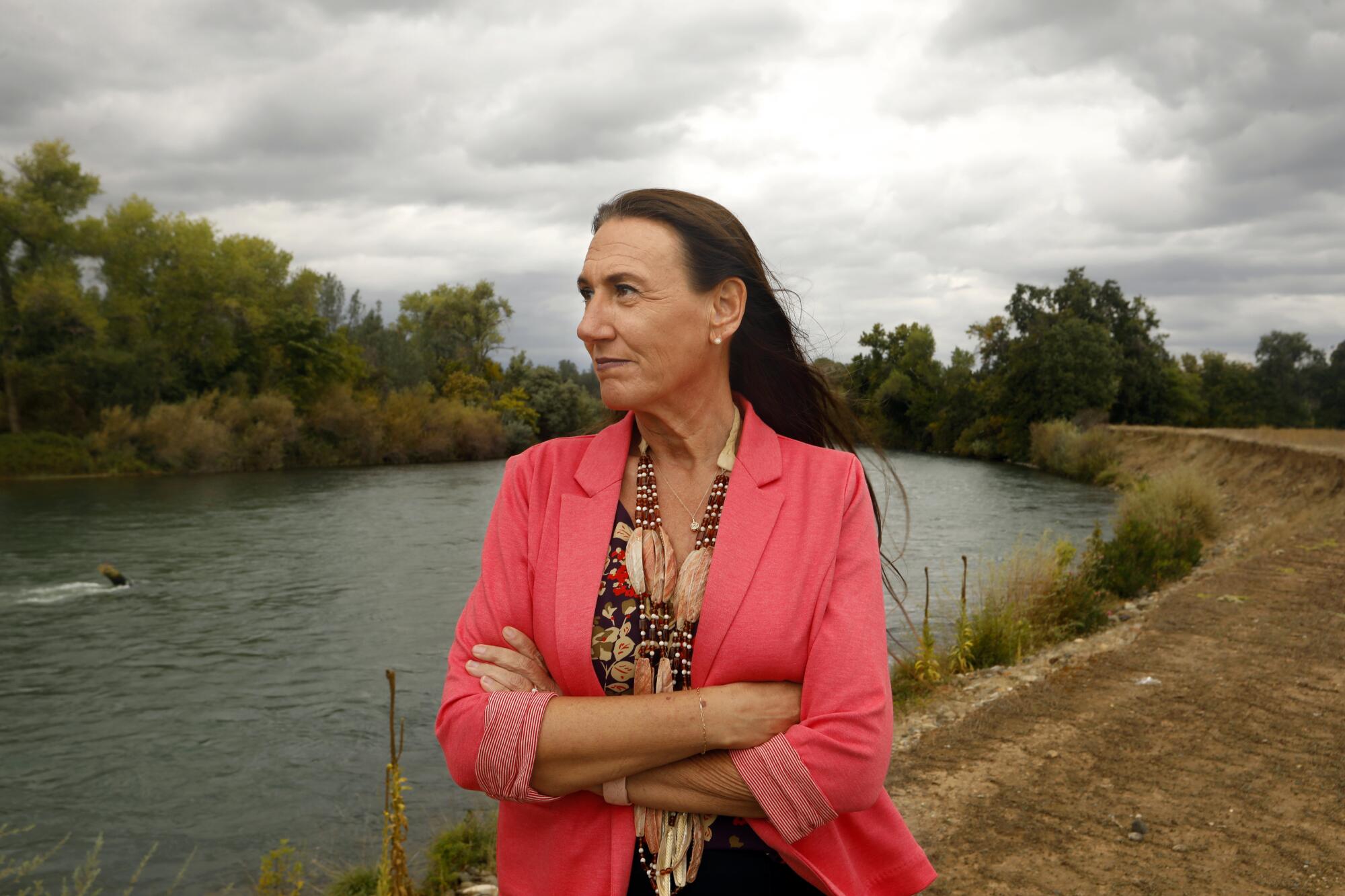 Redding Rancheria CEO Tracy Edwards poses on the banks of the Sacramento River. 