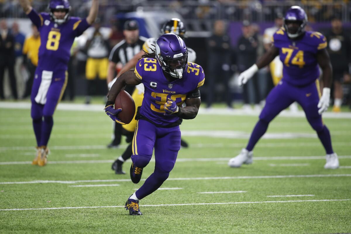 Minnesota Vikings running back Dalvin Cook carries the ball against the Pittsburgh Steelers.