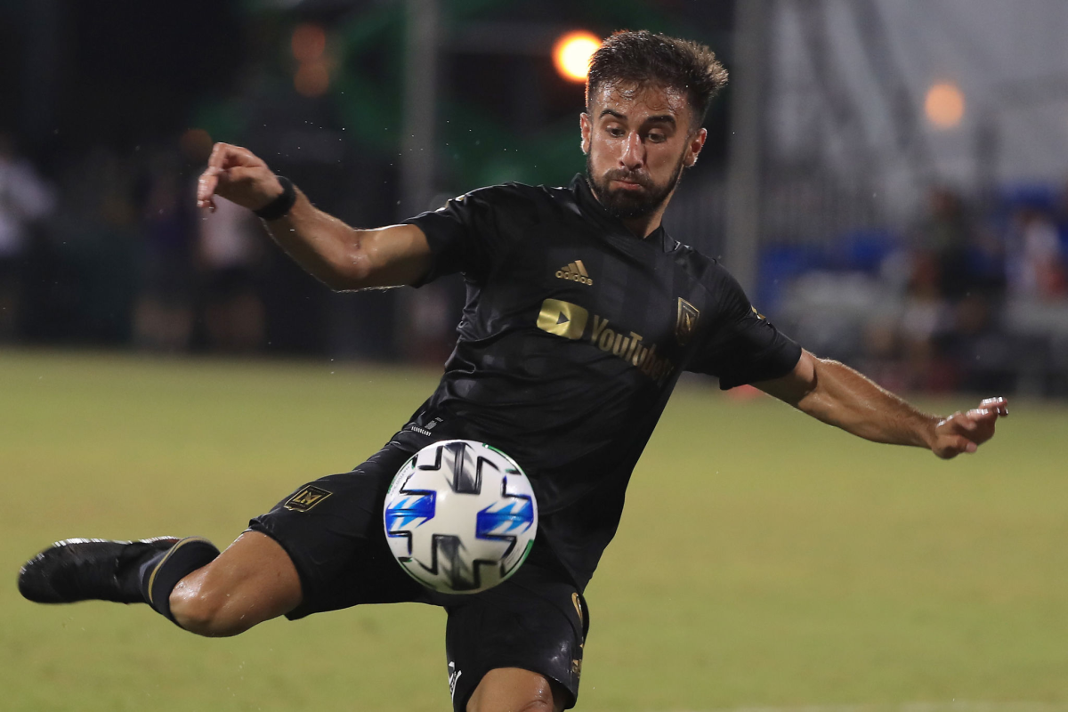 Forward Diego Rossi shoots the ball during a match between LAFC and Houston Dynamo.