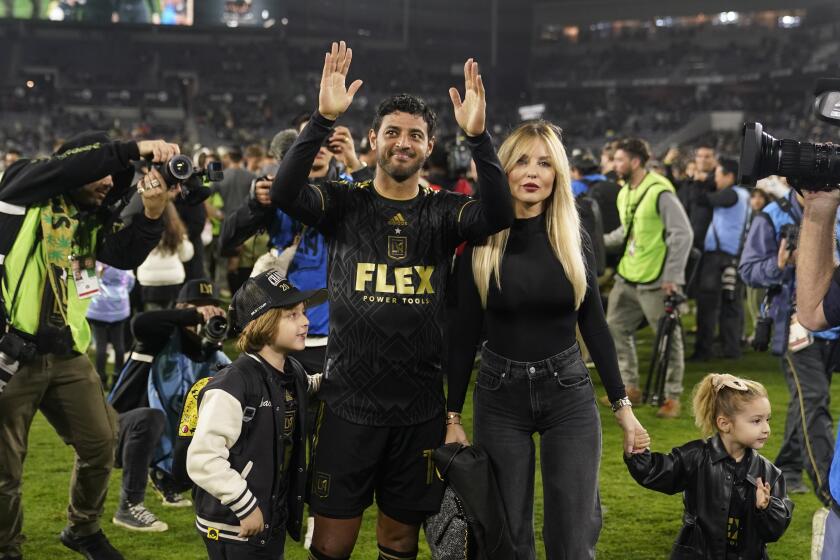 Los Angeles FC forward Carlos Vela celebrates alongside his wife, Saioa Cañibano and children, after Los Angeles FC defeated Houston Dynamo 2-0 to win the MLS playoff Western Conference final soccer match Saturday, Dec. 2, 2023, in Los Angeles. (AP Photo/Marcio Jose Sanchez)