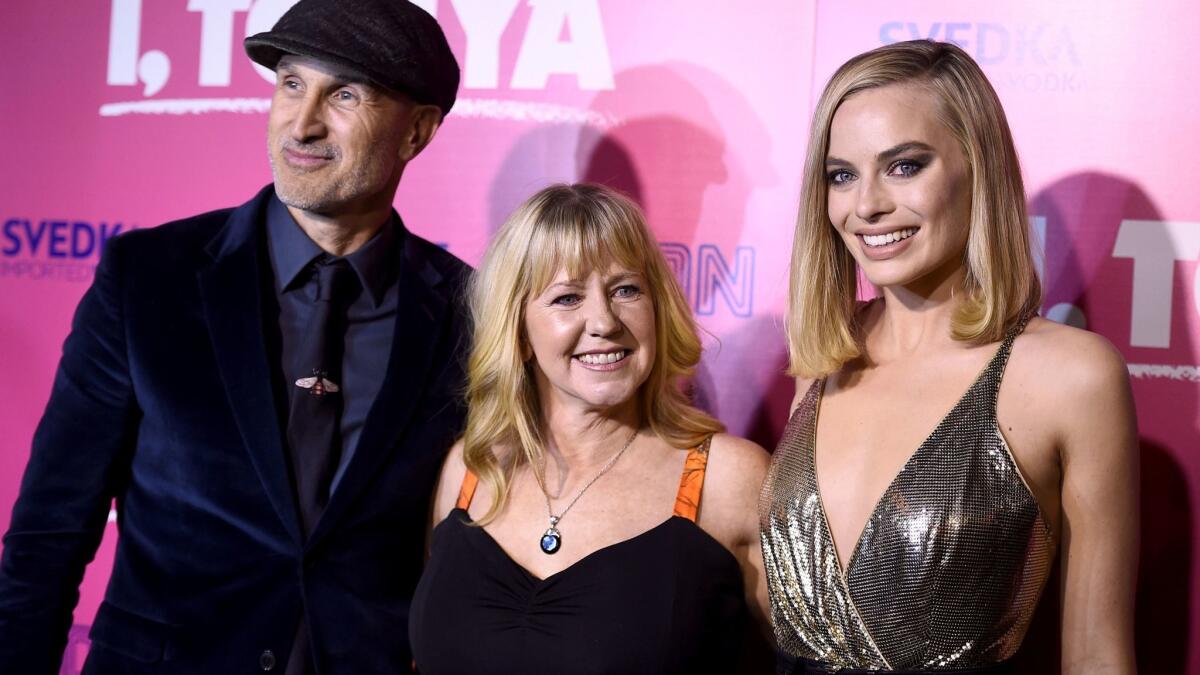 Director Craig Gillespie, from left, Tonya Harding and Margot Robbie arrive at the Los Angeles premiere of "I, Tonya" at the Egyptian Theatre on Tuesday, Dec. 5, 2017. (Photo by Jordan Strauss/Invision/AP)