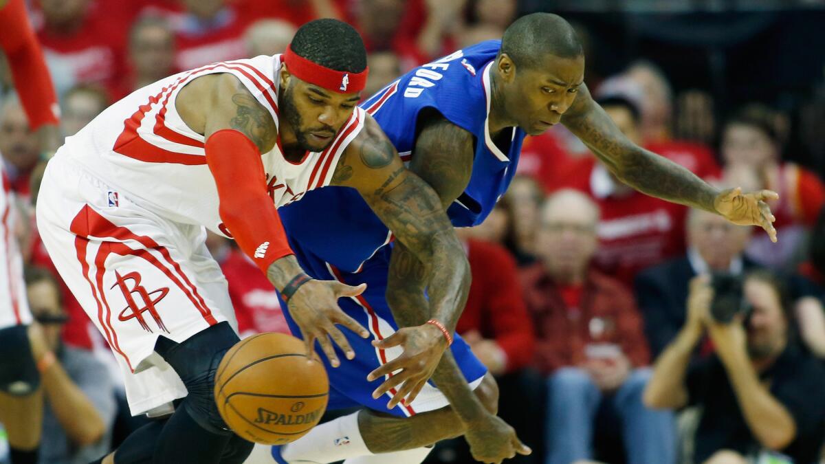 Houston Rockets forward Josh Smith, left, and Clippers guard Jamal Crawford chase after a loose ball during the Clippers' 117-101 win in Game 1 of the Western Conference semifinals on May 4, 2015.