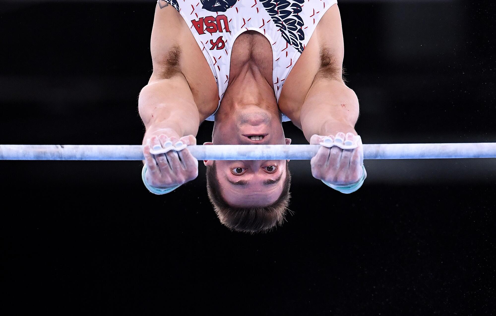 USA's Samuel Mikulak competes on the high bar.