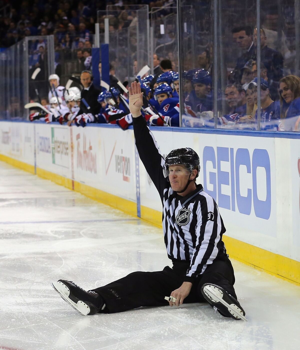 Linesman Jean Morin #97 makes a first period icing call during the game between the New York Rangers and the Washington Capitals in Game Three of the Eastern Conference Quarterfinals during the 2013 NHL Stanley Cup Playoffs at Madison Square Garden on May 6, 2013.
