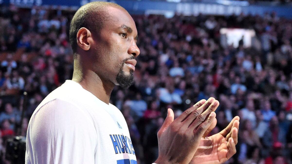 Newly acquired Toronto forward Serge Ibaka applauds on the sideline before a game against Charlotte on Feb. 15.