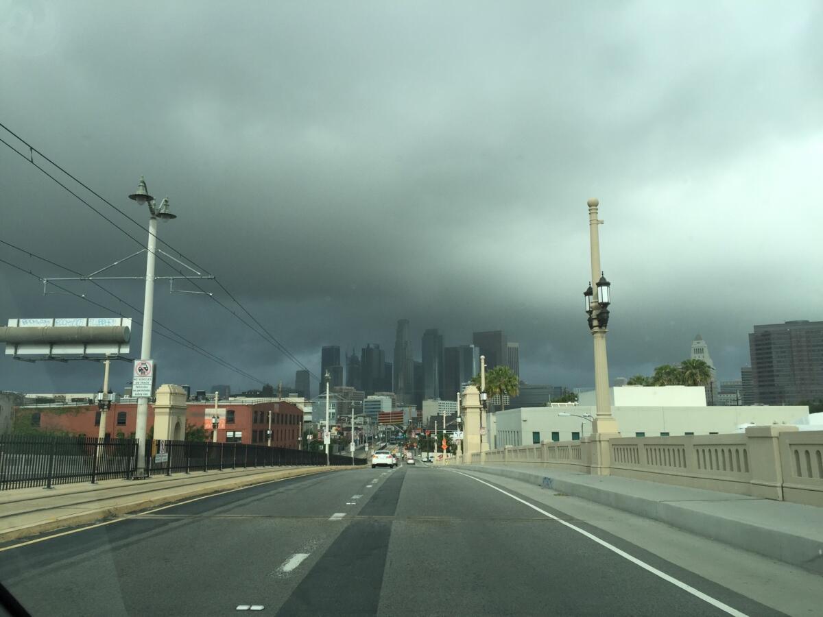 Dark clouds loom over downtown Los Angeles on Monday morning.
