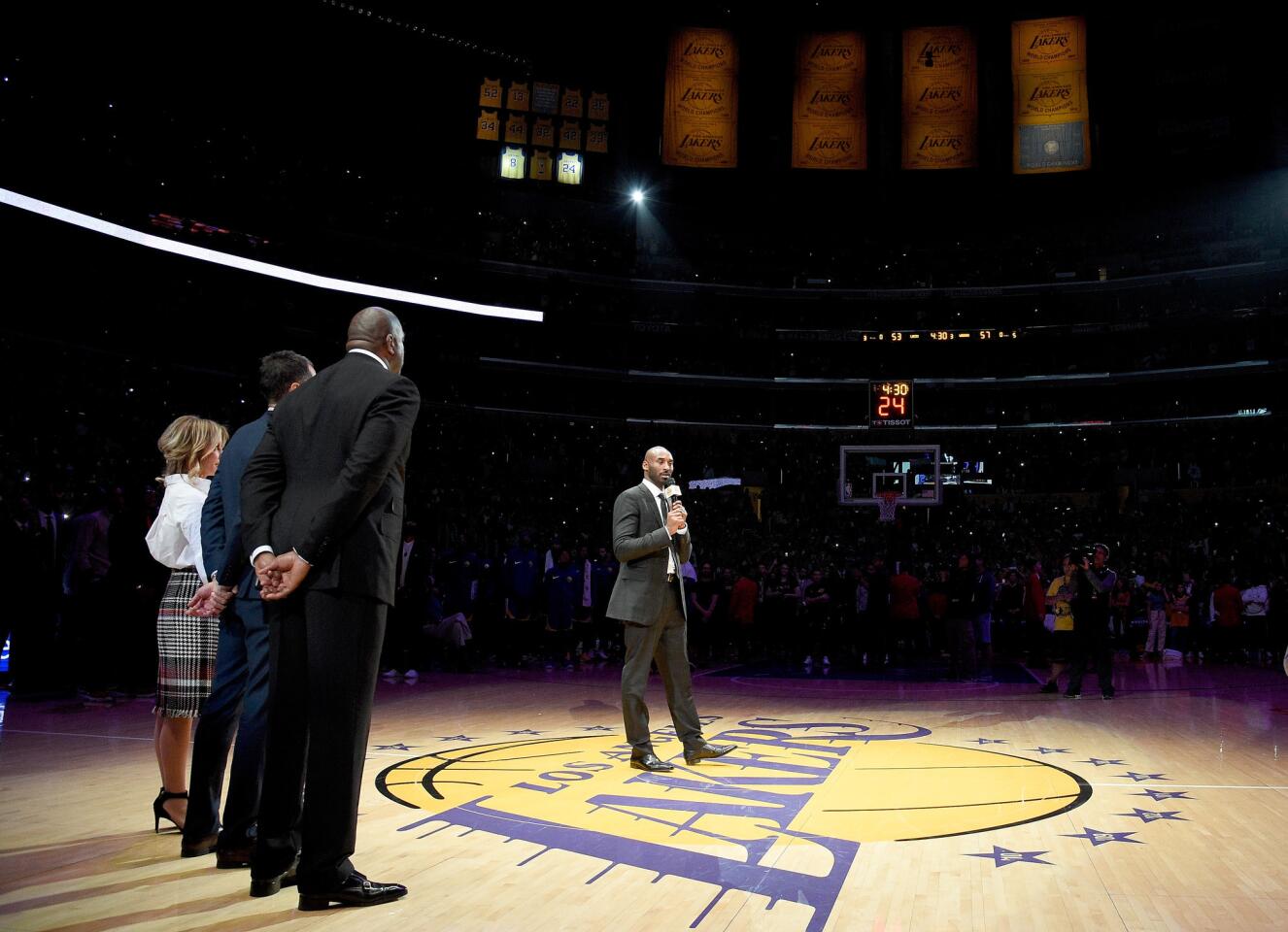 LOS ANGELES, CA - DECEMBER 18: Kobe Bryant addresses the crowd at halftime as both his #8 and #24 Los Angeles Lakers jerseys are retired at Staples Center on December 18, 2017 in Los Angeles, California. NOTE TO USER: User expressly acknowledges and agrees that, by downloading and or using this photograph, User is consenting to the terms and conditions of the Getty Images License Agreement.