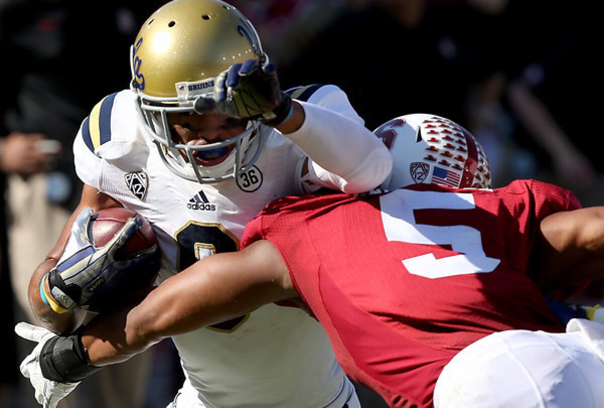 UCLA receiver Jordan Payton, fighting for extra yards against Stanford after a reception last season, calls the increased food allowance by the NCAA "overdue."