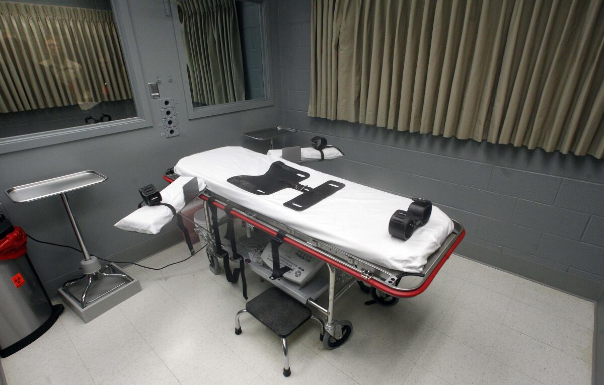 A gurney used for lethal injections in a bare room 