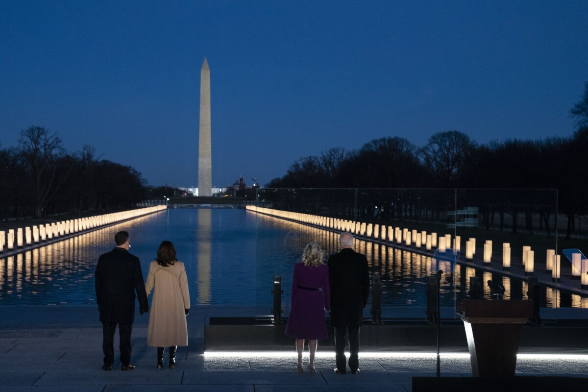 President-elect Joe Biden and Jill Biden with VP-elect Kamala Harris and her husband at a COVID-19 memorial