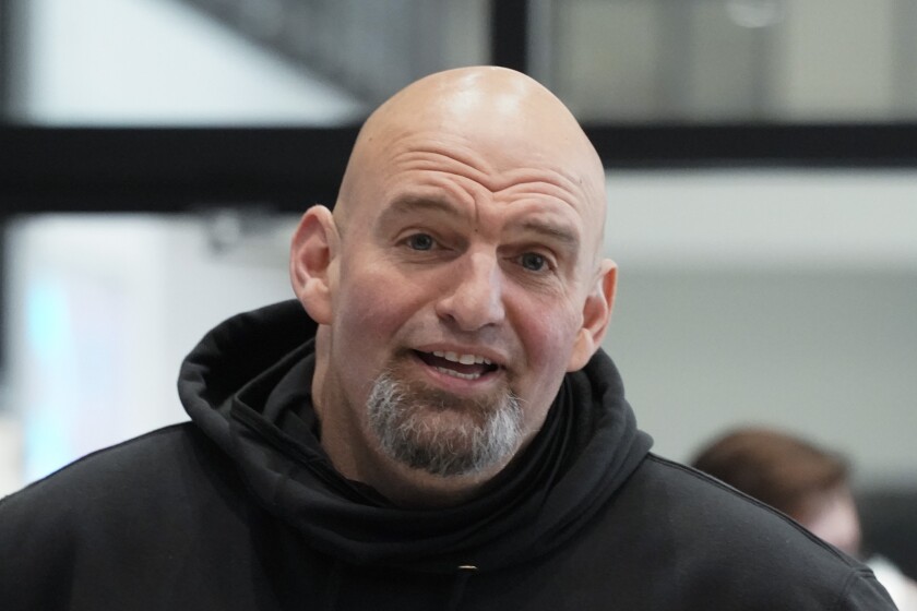 Head shot of Fetterman in a hoodie that isn't pulled up 