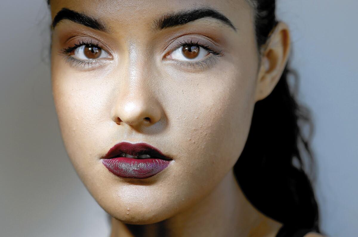 The new fall lip color is dark purple. Lipsticks that fit the bill include Nars' Liv, as seen on model Ashleigh Rae.