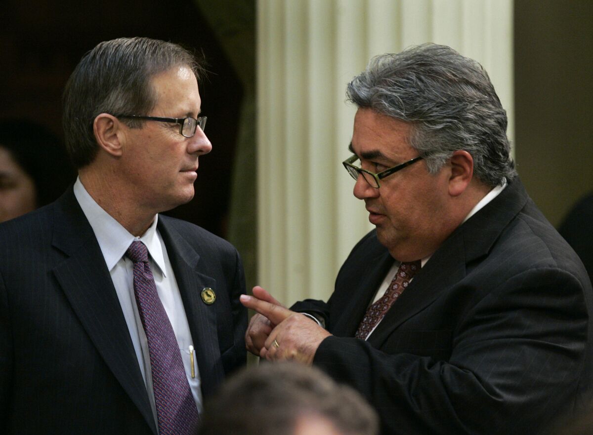 State Sen. Tom Berryhill (R-Modesto), left, pictured during a 2007 floor conversation with state Sen. Ron Calderon, D-Montebello.