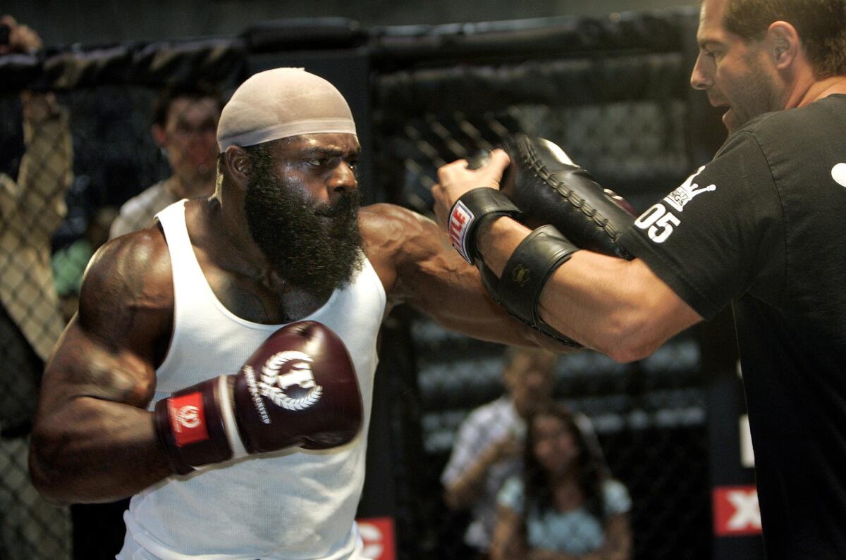 Kimbo Slice, left, works out with trainer Randy Katami at the CBS Studio Center in Studio City on May 19, 2008.
