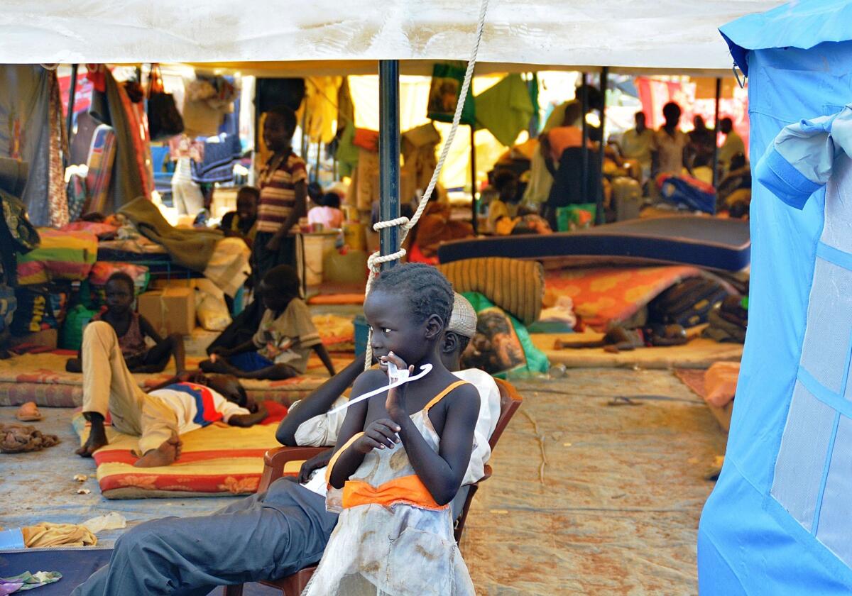 A South Sudanese child stands in a crowded U.N. encampment for displaced people in Juba, the capital. Warring parties in South Sudan delayed direct peace talks on Saturday.