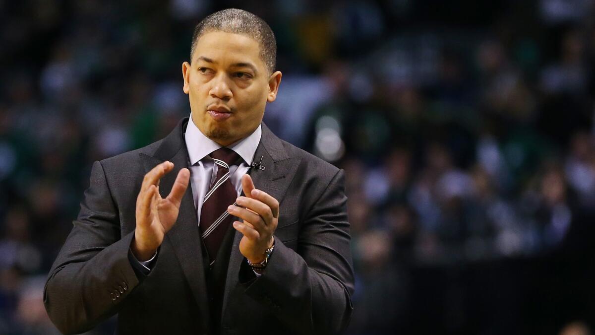 Tyronn Lue looks on during a game between the Cleveland Cavaliers and Boston Celtics in February 2018.